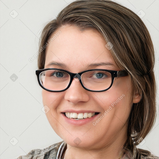 Joyful white young-adult female with medium  brown hair and blue eyes