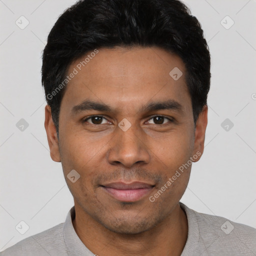 Joyful latino young-adult male with short  black hair and brown eyes