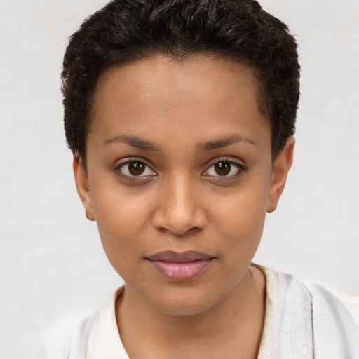 Joyful latino young-adult female with short  brown hair and brown eyes
