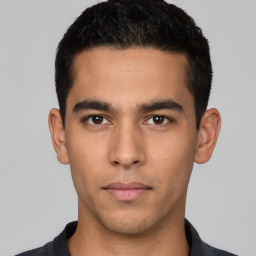 Neutral white young-adult male with short  black hair and brown eyes
