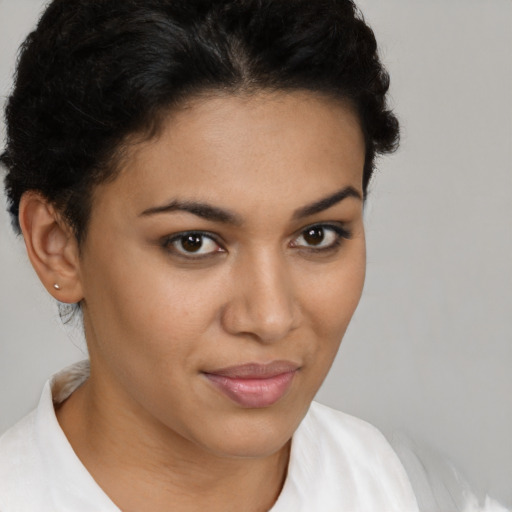 Joyful latino young-adult female with short  brown hair and brown eyes