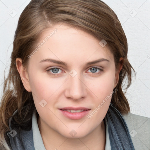 Joyful white young-adult female with long  brown hair and blue eyes