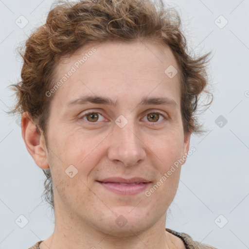 Joyful white adult male with short  brown hair and grey eyes