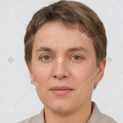 Joyful white adult female with short  brown hair and brown eyes