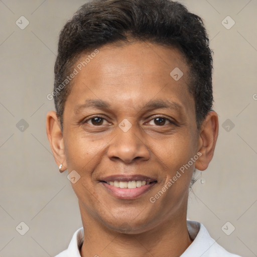 Joyful latino adult male with short  brown hair and brown eyes