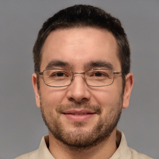 Joyful white adult male with short  brown hair and brown eyes