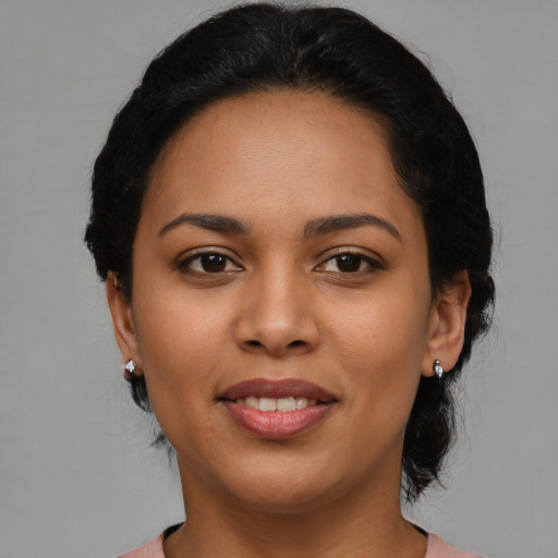 Joyful latino young-adult female with medium  black hair and brown eyes