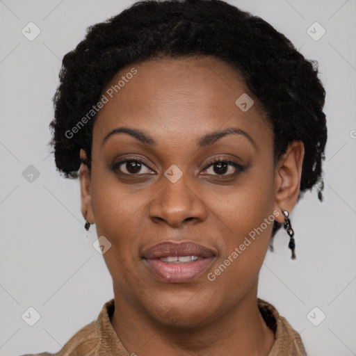 Joyful black adult female with short  brown hair and brown eyes