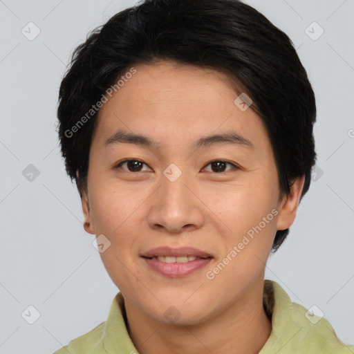 Joyful asian adult female with short  brown hair and brown eyes