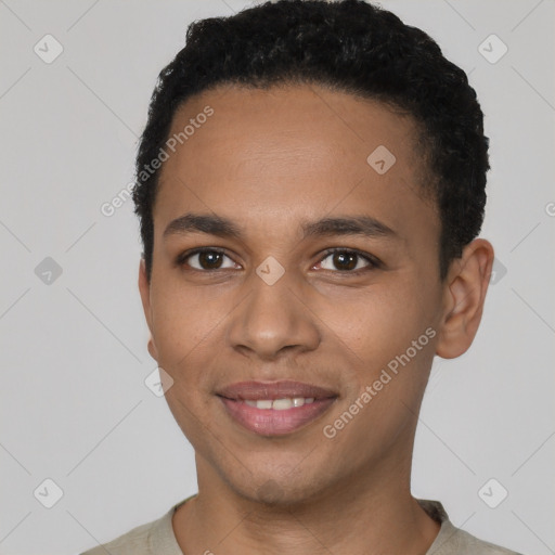 Joyful black young-adult male with short  black hair and brown eyes