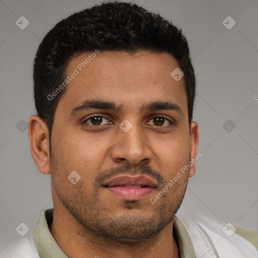 Joyful latino young-adult male with short  brown hair and brown eyes
