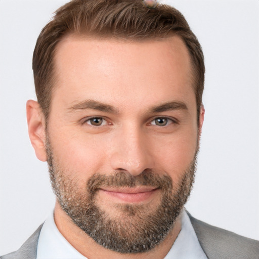 Joyful white young-adult male with short  brown hair and brown eyes