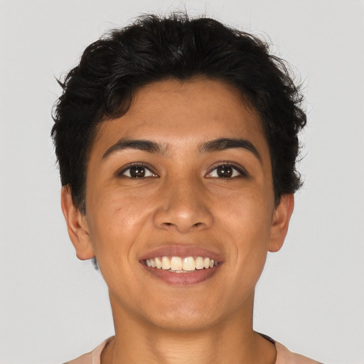 Joyful latino young-adult female with short  brown hair and brown eyes
