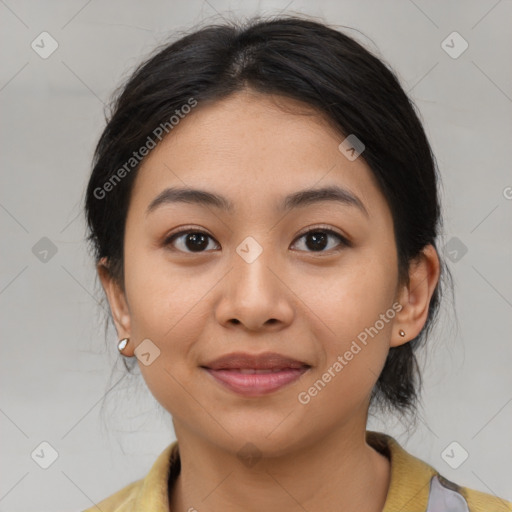 Joyful asian young-adult female with medium  black hair and brown eyes