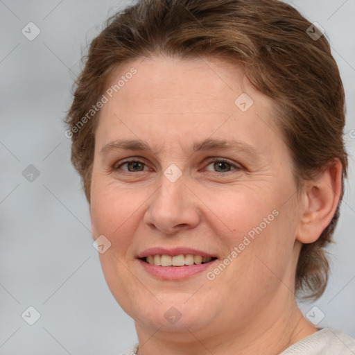 Joyful white adult female with medium  brown hair and brown eyes