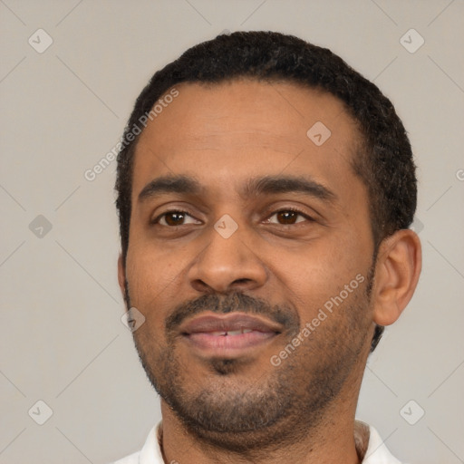 Neutral latino young-adult male with short  black hair and brown eyes