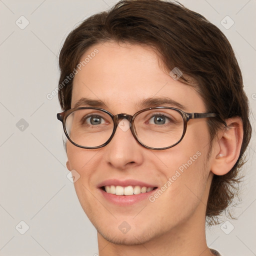 Joyful white young-adult female with short  brown hair and brown eyes