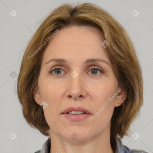 Joyful white adult female with medium  brown hair and brown eyes