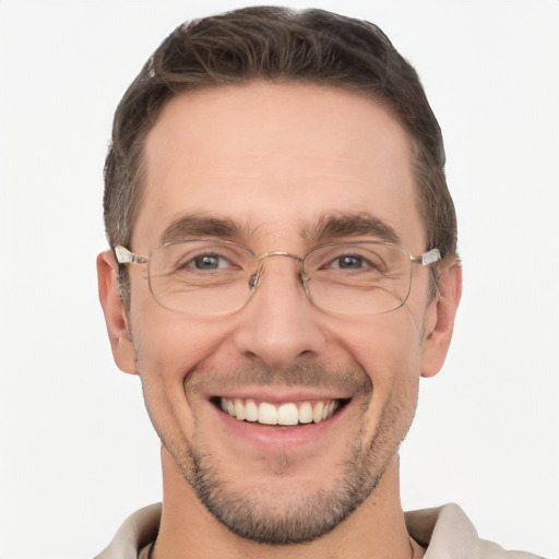 Joyful white adult male with short  brown hair and brown eyes