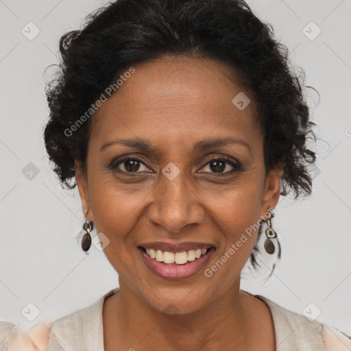 Joyful black adult female with short  brown hair and brown eyes