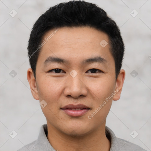 Joyful asian young-adult male with short  black hair and brown eyes