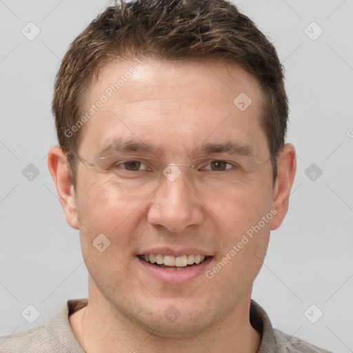 Joyful white adult male with short  brown hair and grey eyes