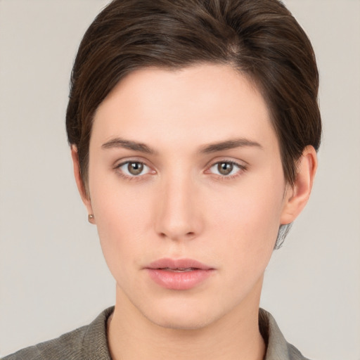 Neutral white young-adult female with short  brown hair and brown eyes