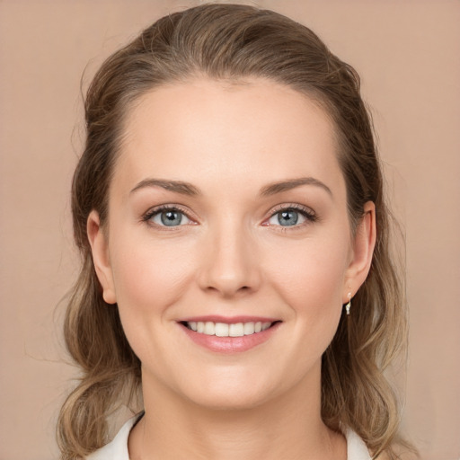 Joyful white young-adult female with medium  brown hair and grey eyes