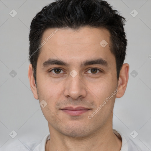 Joyful white young-adult male with short  black hair and brown eyes