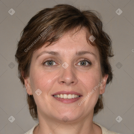 Joyful white adult female with medium  brown hair and blue eyes