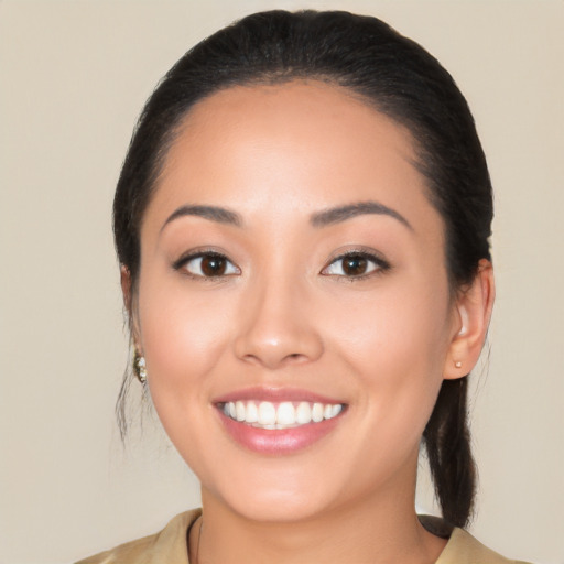 Joyful white young-adult female with medium  black hair and brown eyes