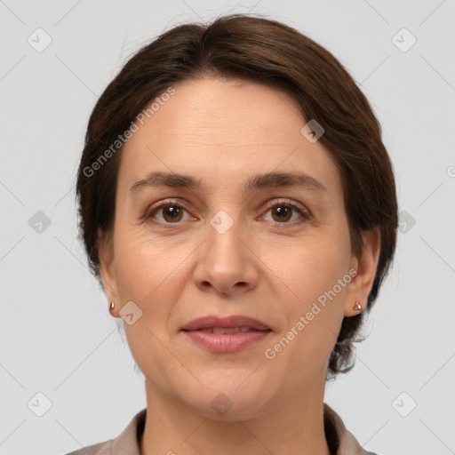 Joyful white adult female with medium  brown hair and grey eyes