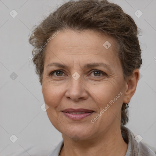 Joyful white adult female with short  brown hair and brown eyes