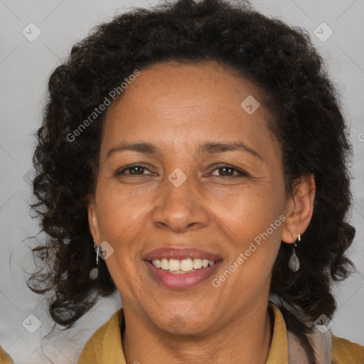 Joyful black adult female with medium  brown hair and brown eyes