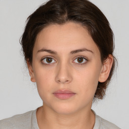 Neutral white young-adult female with medium  brown hair and brown eyes