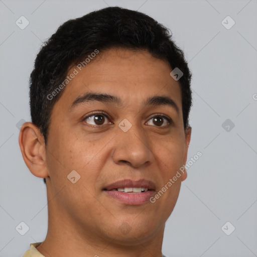 Joyful latino young-adult male with short  brown hair and brown eyes