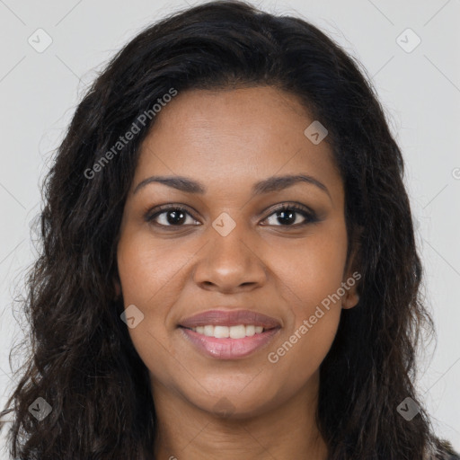 Joyful black young-adult female with long  brown hair and brown eyes