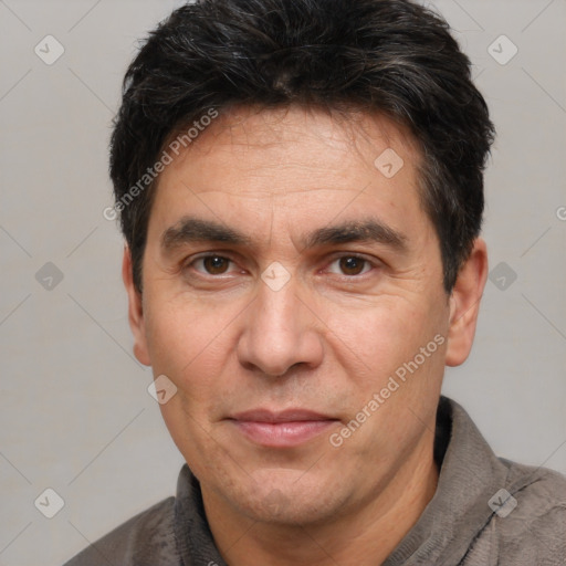 Joyful white adult male with short  black hair and brown eyes