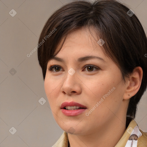 Joyful asian young-adult female with medium  brown hair and brown eyes
