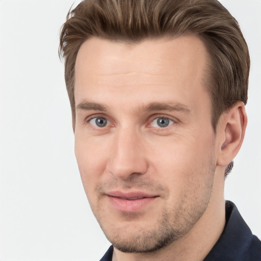 Joyful white young-adult male with short  brown hair and brown eyes