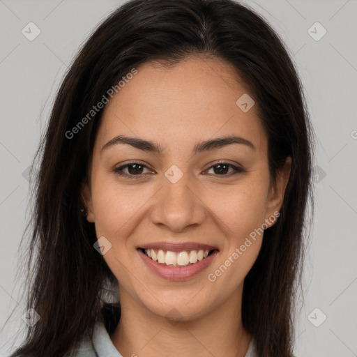 Joyful latino young-adult female with long  brown hair and brown eyes