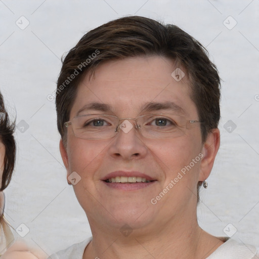 Joyful white adult female with short  brown hair and brown eyes