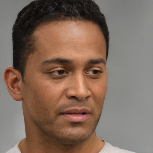 Neutral black young-adult male with short  brown hair and brown eyes