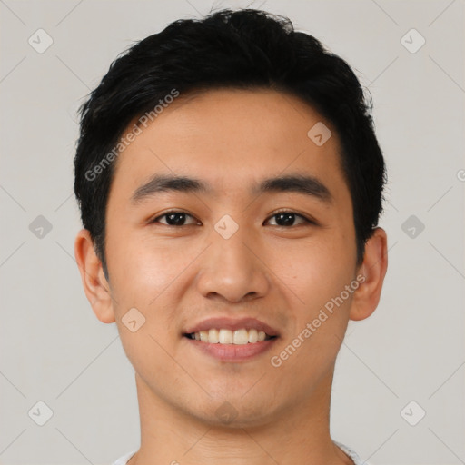 Joyful asian young-adult male with short  black hair and brown eyes