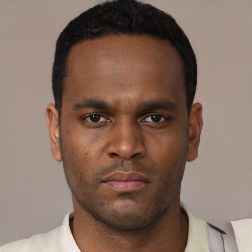 Neutral black young-adult male with short  brown hair and brown eyes