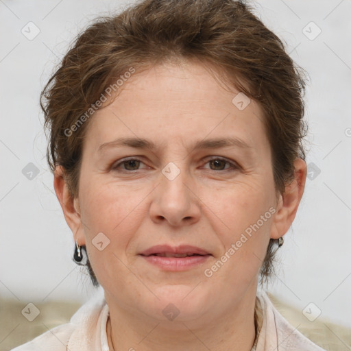 Joyful white adult female with short  brown hair and brown eyes