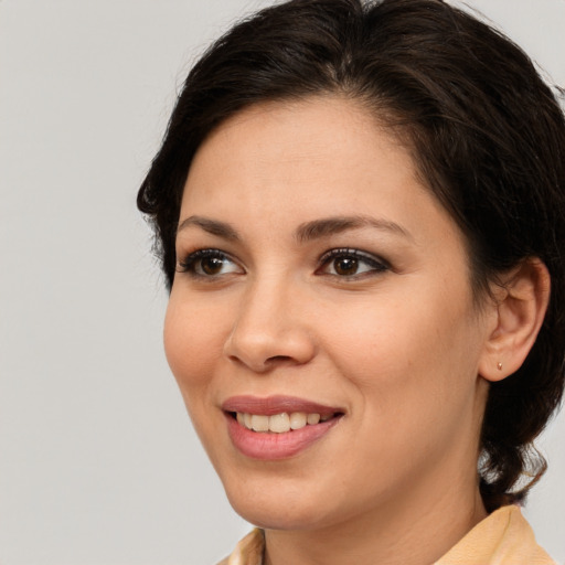 Joyful white young-adult female with medium  brown hair and brown eyes