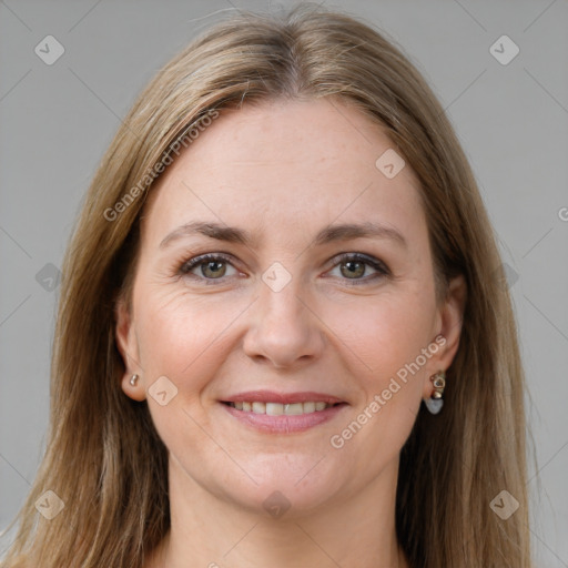 Joyful white young-adult female with long  brown hair and grey eyes