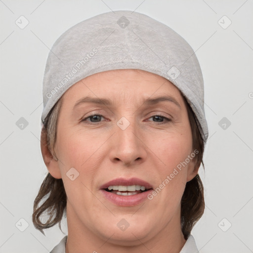 Joyful white adult female with medium  brown hair and grey eyes