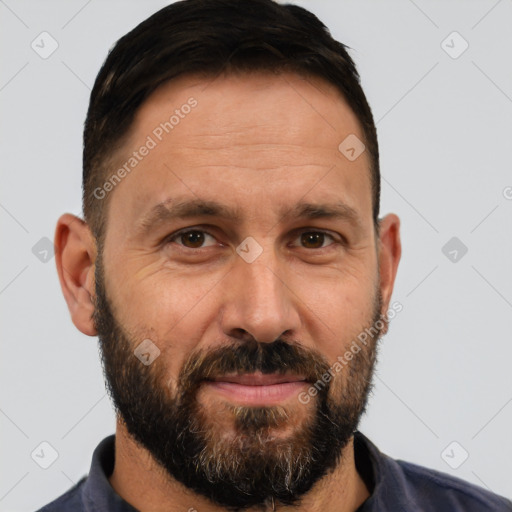 Joyful white adult male with short  brown hair and brown eyes